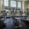 spacious and bright fitness center filled with equipment