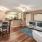 well lit, open concept living room dining area and kitchen